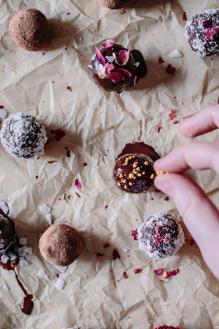 Simple + Easy Raw Vegan Adaptogen Coconut Cacao Bliss Balls recipe with Reishi & He Shou Wu. These healthy, protein and superfood packed energy bites are made with dates, almonds, raw chocolate powder, and healing herbs making them the perfect dairy-free, gluten-free, paleo, and Whole 30 friendly snack! Even kids love them!