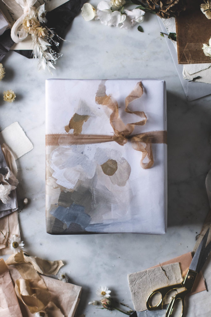 Christmas DIY: Zero waste, eco friendly upcycled paper holiday, painting by Rebekka Seale, gift wrap with dried flower DIY gift toppers and hand dyed silk ribbon. | By Beth Kirby / Local Milk
