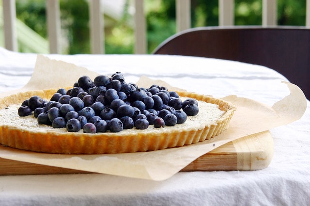 blueberry ricotta tart on table